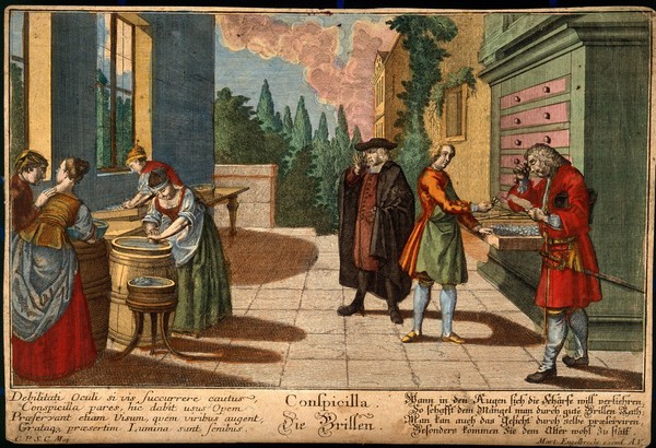 Women grind glass lenses while two customers try spectacles on. Coloured line engraving, 1799.