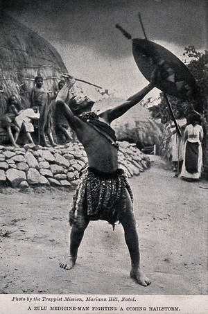 view A Zulu medicine man or shaman performing a ritual to fend off a hailstorm, South Africa. Halftone after Trappist Mission, Natal.