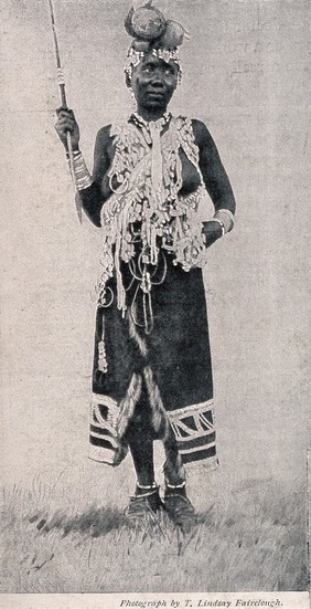 A Zulu medicine woman or shaman practising in Basutoland, South Africa. Halftone after a photograph by L. Fairclough.