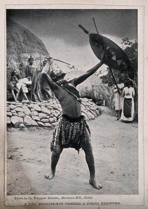 view A Zulu medicine man or shaman performing a ritual to fend off a hailstorm, South Africa. Halftone after Trappist Mission, Natal.