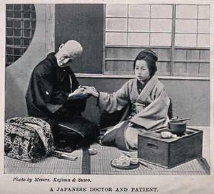 view A Japanese doctor taking the pulse of a patient. Halftone after a photograph by Messrs. Kajima & Suwo.