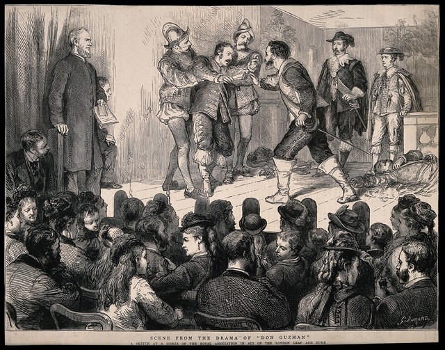 Deaf actors using sign language perform a play about Don Guzman to an audience in St Saviour's church hall, London. Wood engraving by G. Durand, 1877.