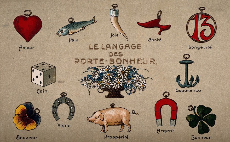 A postcard illustrating a variety of good luck charms. Chromolithograph.