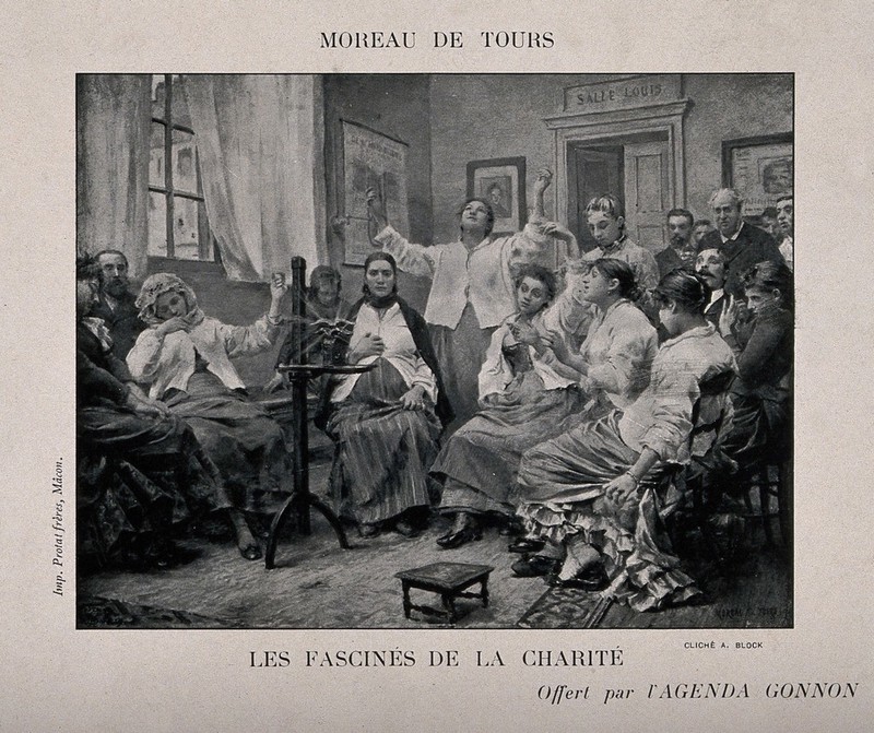 Mentally ill people at the Charité hospital sitting and looking at a piece of apparatus (camera?). Photogravure by C. Block after G. Moreau de Tours., May 1905, by Georges Moreau de Tours