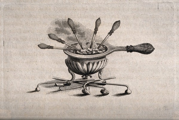 A receptacle for burning coal to heat cautery instruments. Engraving.