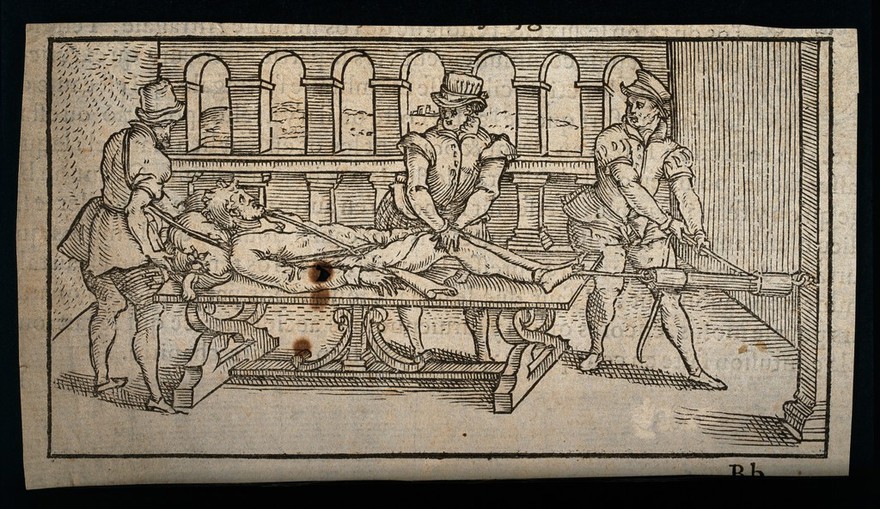 A surgeon and two assistants using pulleys and ropes to aid traction for manipulating the body of a male patient. Woodcut, 1575.