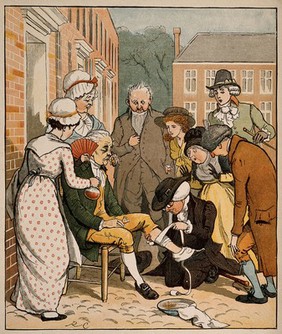 A surgeon bandaging an elderly man's knee in a street surrounded by a group of onlookers. Colour process print after R. Caldecott.