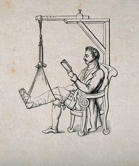 A man sitting in a chair reading while his leg is in traction and attached to a pulley mechanism. Wood engraving.