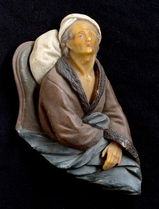 A patient in bed. Wax sculpture by a German artist.