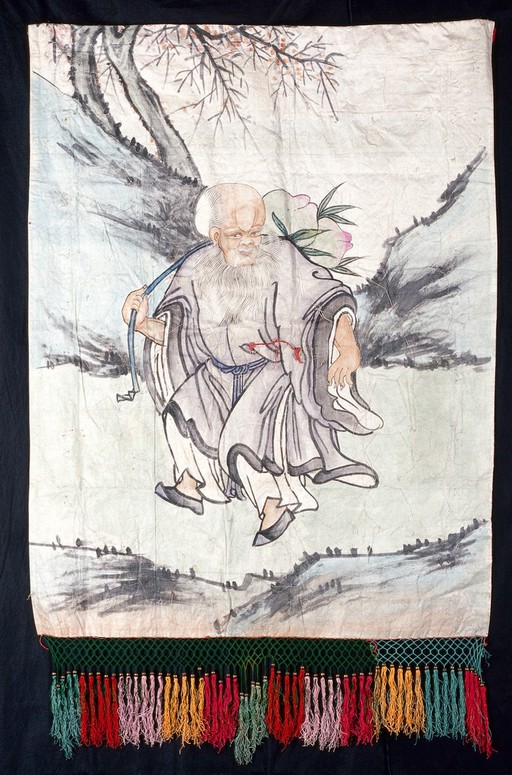 A man in a landscape. Watercolour and embroidery by a Chinese artist or artists.