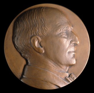 Henry Solomon Wellcome. Bronze plaque by M. Gillick.