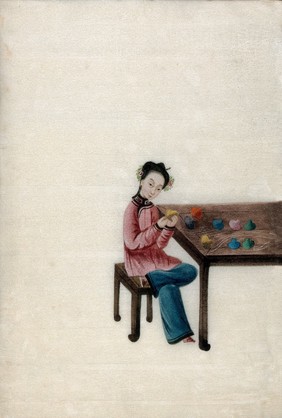 A woman preparing coloured silk thread (?). Watercolour by a Chinese artist, ca. 1800.