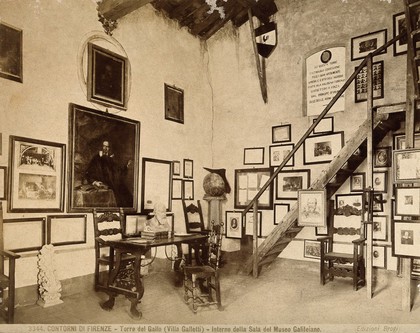 Galileo Galilei: interior of Villa del Gallo, Count Galletti's museum of Galileo, with two portraits of Galileo on the wall of a vaulted room. Process print.