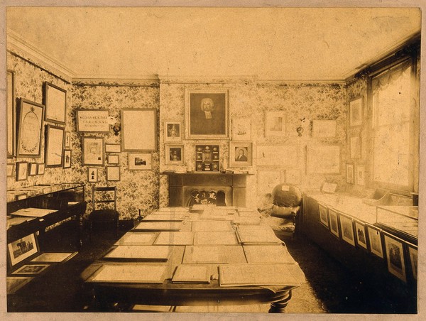 Room where Frederick Mockler's collection of Jenneriana was displayed; parts of which are seen on the walls and on the central table. Photograph.