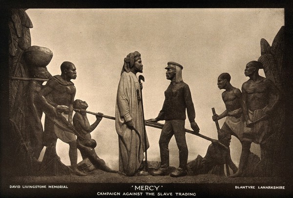 David Livingstone memorial in Blantyre; Livingstone facing African men. Photoprint.