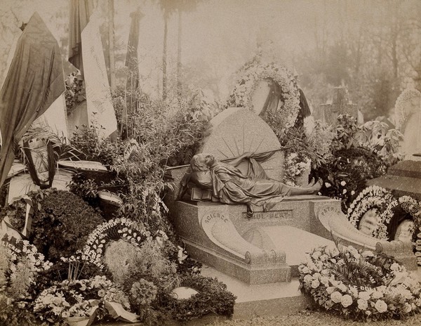 Auxerre, France: tomb of Paul Bert, covered with wreaths of flowers. Photograph.