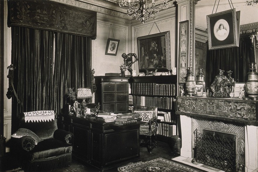 Professor and Mrs Dejerine's study in their flat Boulevard Saint Germain, Paris; desk, armchair, chimney and book. Photograph.