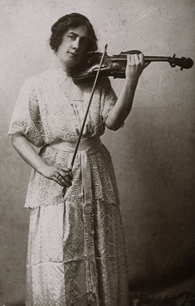 Miss Julia Klumpke, playing the violin. Photograph.