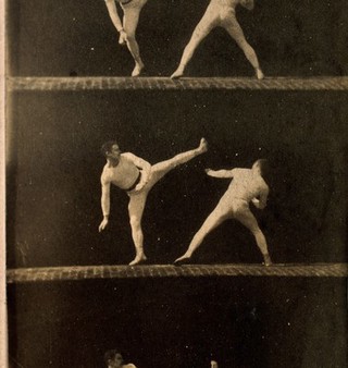 Two men dressed in white, wrestling, sequences. Photograph.