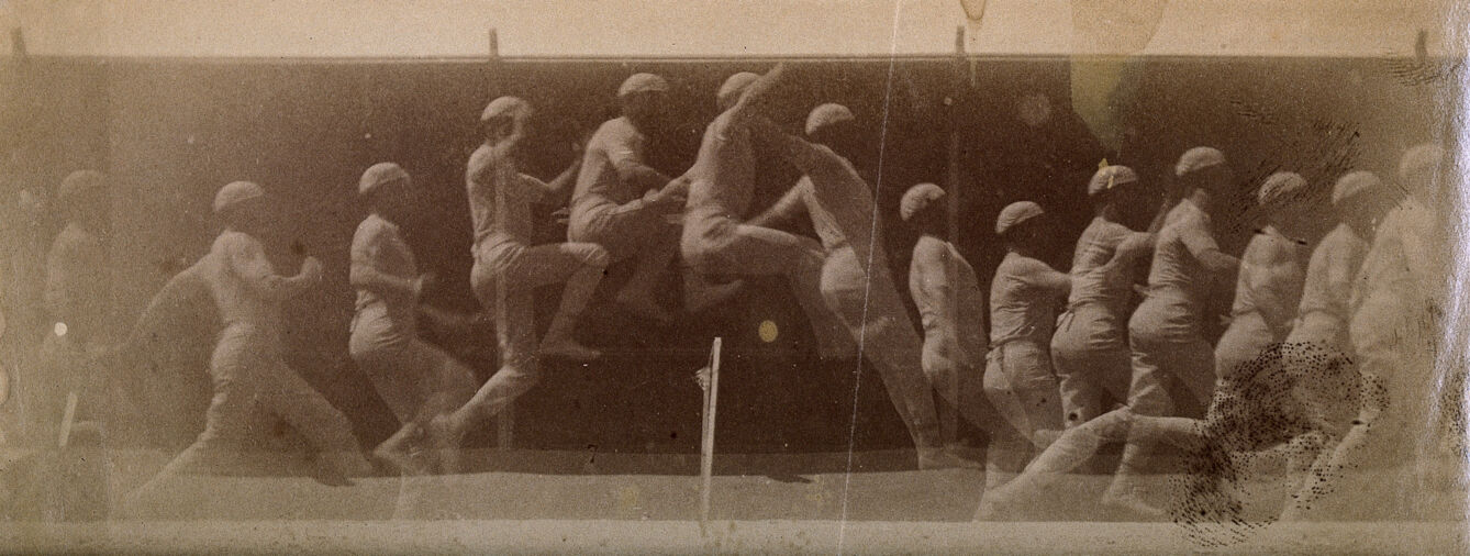 A man dressed in white, jumping over a hurdle; sequences. Photograph.