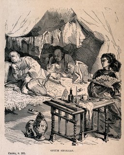 Two Chinese opium smokers in a booth watched by a woman who fans herself. Wood-engraving, late 19th century.
