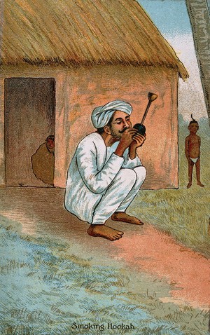 view An Indian seated outside his house smoking a hooka. Chromolithograph.