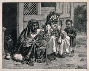 view An old Afghan man sits with a woman and child on the ground smoking a hooka. Wood-engraving after F. Dadd.