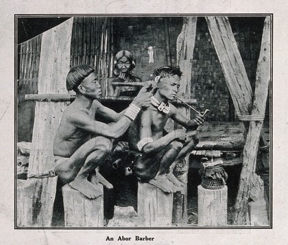 An "Abor barber" dressing a man's hair. Halftone.