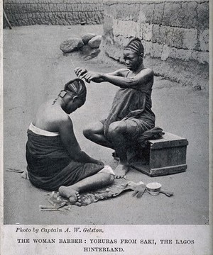 view A Yoruba female hairdresser dressing the hair of a woman. Halftone after A.W. Gelston.