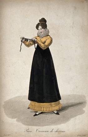 A woman holding out a ribbon with ringletted hair-pieces attached to it. Coloured engraving by G.J. Gatine after L.M. Lanté.