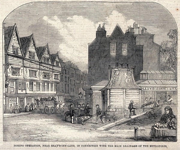 Boring operation to connect the drainage system near Grays Inn Lane to the main sewage system. Wood engraving.