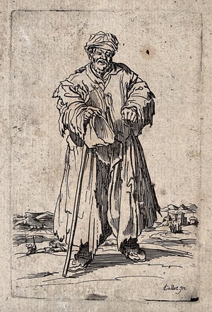 view A bearded beggar dressed in rags holding a hat and a staff in his right hand. Etching by J. Callot.