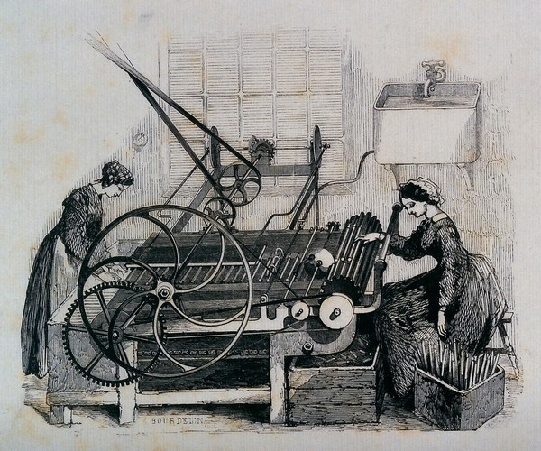 Two women using machinery in the making of candles. Wood engraving by E. Bourdelin.