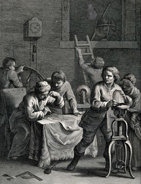A workshop with a lathe in the background, and a man with spectacles looking at a diagram in the foreground. Engraving.