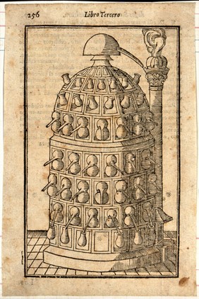 Chemistry: a multi-tiered furnace for distillation. Woodcut after M. Augusti.