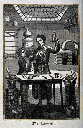 A chemist holds up a flask to show his young assistant. Woodcut.