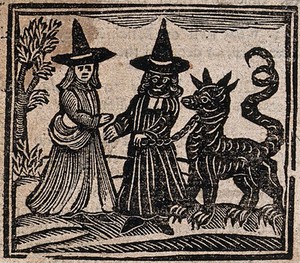 view Witchcraft: a white-faced witch meeting a black-faced witch with a great beast. Woodcut, 1720.