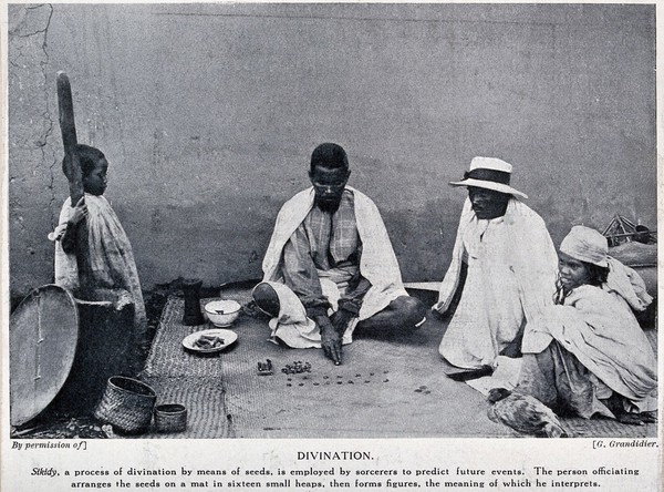 A man in Madagascar predicting the future with seeds (sikidy). Process print, ca. 1930, after G. Grandidier.