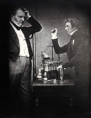 Michael Faraday (right) with John Frederick Daniell (inventor of the electrochemical cell). Copy photograph after the 1843 original.