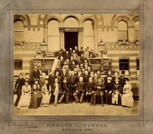 view Health Congress, Brighton: group of about sixty delegates assembled on hotel (?) entrance steps. Photograph, 1890.
