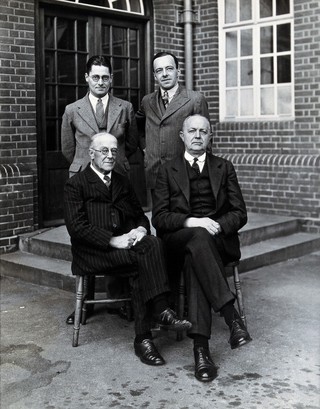Louis Cobbett, Henry Roy Dean, Howard Walter Florey and Harry Norman Green. Copy photograph, ca. 1960, after the original photograph, ca. 1935.