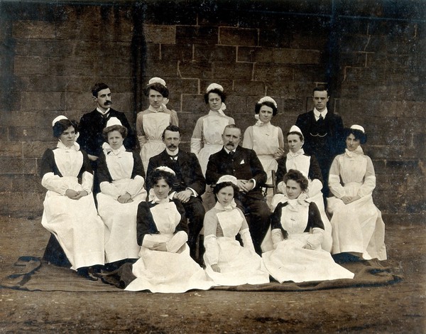 James Rutherford Morison with his staff: three men and ten women. Photograph, ca. 1900.