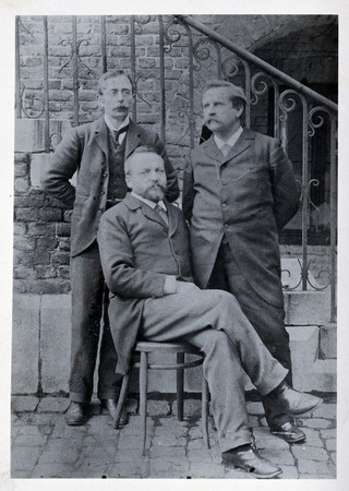 Charles Sherrington (left), Leon Fredericq (seated) and Paul Grützner (right) outside the Institute of Physiology in Liège. Copy photograph (1940?) after the 1898 original.