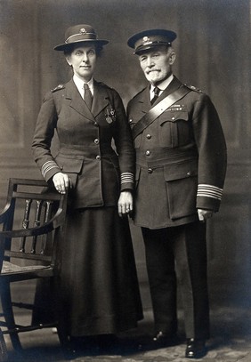 Sir James Cantlie and Lady Cantlie (both standing) in St. John's Ambulance uniform. Photograph by F.C. Stoate, ca. 1914/1918.