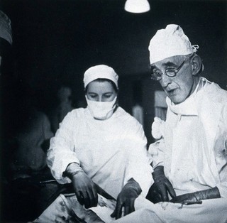 British Postgraduate Medical School, Hammersmith: G. Grey Turner operating, 1946. Photograph by K.W. Wilkinson, 1946.