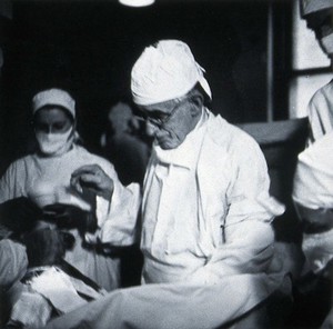 view British Postgraduate Medical School, Hammersmith: G. Grey Turner operating, 1946. Photograph by K.W. Wilkinson, 1946.