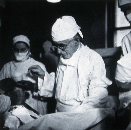 British Postgraduate Medical School, Hammersmith: G. Grey Turner operating, 1946. Photograph by K.W. Wilkinson, 1946.