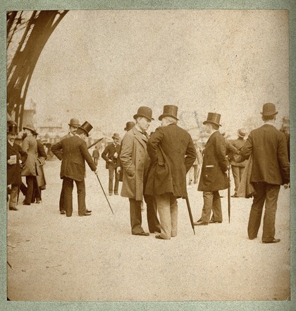 Eiffel Tower, Paris: Thomas Alva Edison and another man chatting at the base of the tower. Photograph, 1889.
