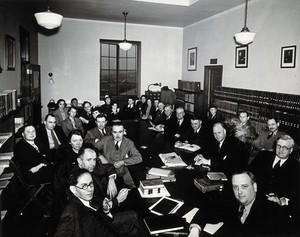 view Johns Hopkins University, Baltimore: the Institute for the History of Medicine: staff (?) seated around a large table. Photograph by Eduard Althausen, ca. 1947.