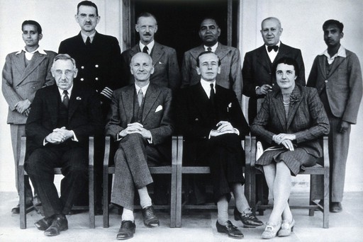 The Medical Mission for Experts on their visit to India: group portrait includes Sir Weldon Dalrymple-Champneys (front row, centre right) and Henry E. Sigerist (back row, second from right). Photograph after a photograph by Kundan Lal, ca. 1950.